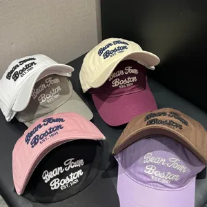 Detail view of multi-color American retro soft-top baseball caps with front embroidery.