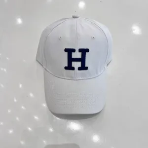 White baseball cap with blue embroidered letter H, casual curved brim hat for daily wear.