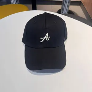 Details of the black streetwear baseball cap with white 3d letter embroidery for daily wear.