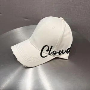 White baseball cap with black embroidered text and distressed brim for sun protection.