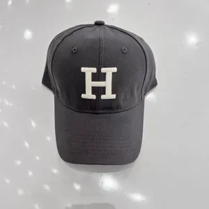 Dark grey baseball cap with white H embroidery, stylish curved brim casual hat for daily wear.