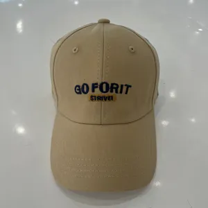 Detailed view of the khaki cotton baseball cap with stylish front embroidery design.