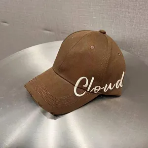Brown baseball cap with white embroidered letter design, casual sun protection dad hat.