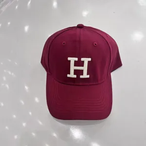 Burgundy baseball cap for women and men, classic curved brim hat with white embroidered letter H.