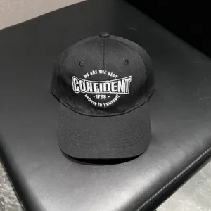 Black embroidered baseball cap detail shot, stylish dad hat for daily wear and outdoor sports.