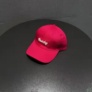 Stylish hot pink baseball cap for women with white Peachy embroidery, casual sun protection brim.