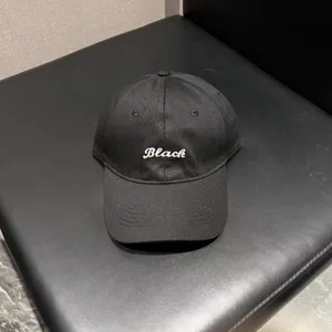 Classic black baseball cap with white embroidered lettering. Casual soft top hat for daily wear.