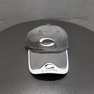 Trendy color-blocked baseball cap with stylish embroidery, comfortable dad hat for outdoor sun protection.