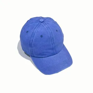 Detailed view of blue washed denim baseball cap, vintage cotton fabric, curved brim, unisex.