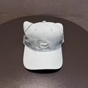 Cute cat ear baseball cap detail shot, casual soft top street style hat for women.