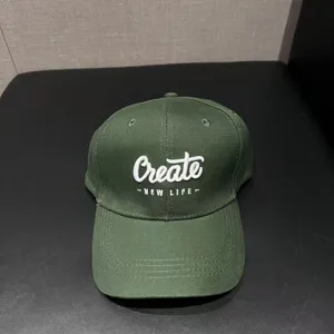 Detailed view of dark green baseball cap with embroidery, casual sun protection style.