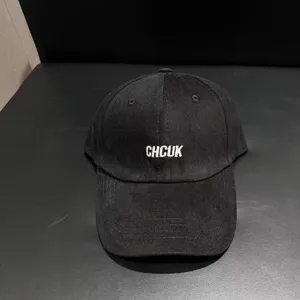 Detailed view of the black brushed cotton baseball cap featuring front custom embroidery design.
