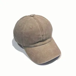 Close-up detail of the distressed washed cotton baseball cap with curved brim and eyelets.