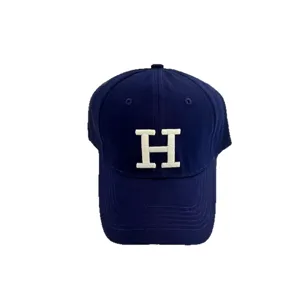 Classic navy blue baseball cap featuring a white embroidered letter H, retro style curved brim hat.