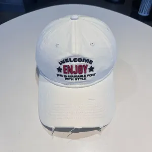 White American baseball cap with embroidered lettering and distressed brim for stylish daily wear.