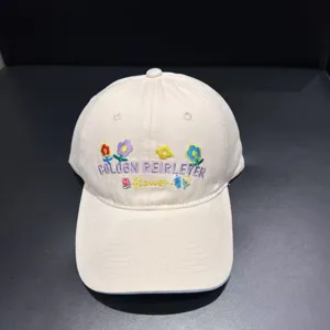 Beige embroidered baseball cap, minimalist casual style, cute flower and letter design for summer.