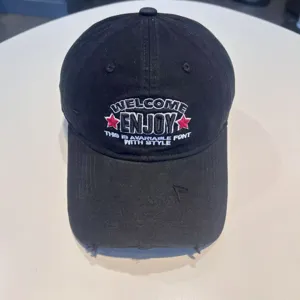 Black cotton baseball cap with ENJOY embroidery and distressed brim for a stylish casual look.