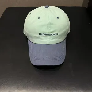 Korean style contrast color soft top embroidered baseball cap with unique letters detail view.