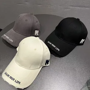 Classic cotton baseball cap with letter embroidery, stylish and casual sun protection hat.