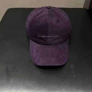 Purple corduroy baseball cap with embroidered letters, soft top casual hat for daily wear.