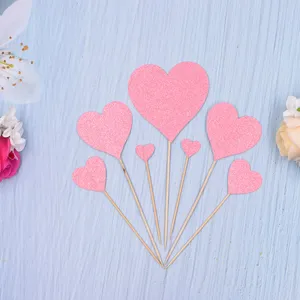 Pink glitter heart cake toppers set of 7, perfect for birthday party cake decoration details and cute dessert table setup.