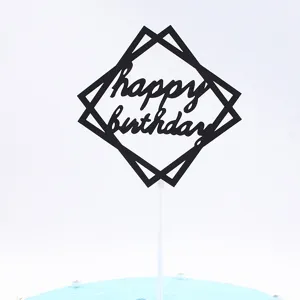 Black geometric square happy birthday cake topper detail for party celebration decor.