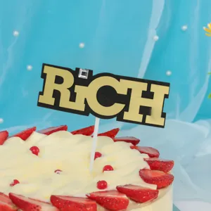 Gold and black RICH cake topper detail view, perfect for birthday dessert table party baking.