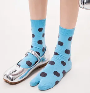 Detailed view of women's sweet polka dot mid-calf split-toe socks in retro style.