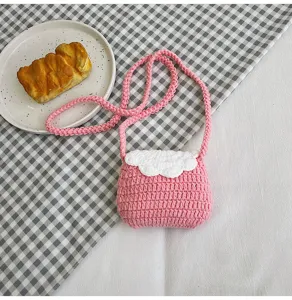 Handmade crochet mini crossbody bag detail view, sweet pink and white design for daily wear.