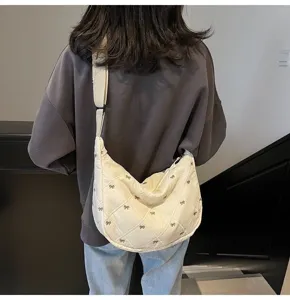 Casual quilted dumpling shoulder bag with cute bow prints, perfect for autumn winter daily use.