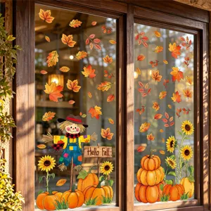 Autumn window sticker detail showing scarecrow, pumpkins, sunflowers, and falling maple leaves.