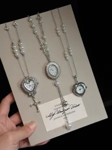 Vintage pearl watch necklace with cross pendant, elegant sweater chain for women.
