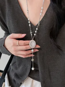 Long pearl sweater chain with vintage pocket watch pendant and cross charms for women.