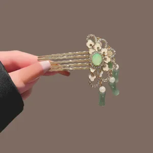 Neo-Chinese vintage style hair comb with green jade-like accents, pearls and delicate tassels.