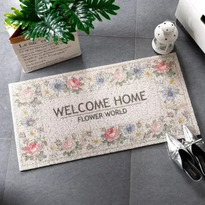 Rechteckige PVC-Schlingenfussmatte mit Retro-Blumenmuster und Willkommenstext fuer den Eingang.