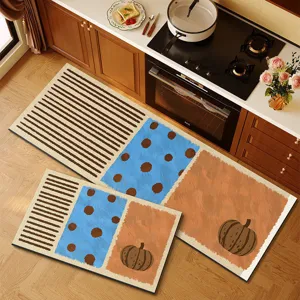 Detailed view of kitchen floor mat set featuring anti-slip diatomaceous earth material with pumpkins.