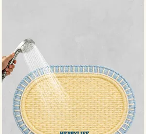 Oval bathroom absorbent anti-slip floor mat, quick dry woven foot rug for home shower.