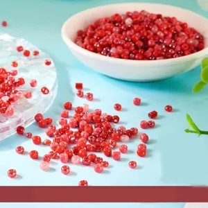 Close-up detail of 4mm red glass seed beads, perfect for DIY jewelry making and bracelets.