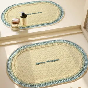 Oval woven bathroom floor mat with soft texture, absorbent non-slip rug for home decor.