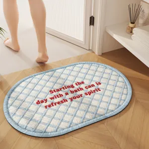 INS style oval bath mat with blue and white grid pattern and red embroidery text, absorbent mat.