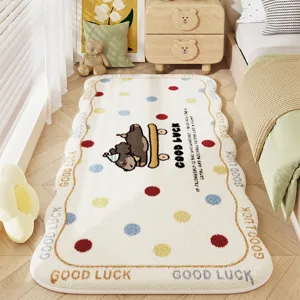 Detail view of fluffy bedside rug with cute cartoon animal print and polka dots, soft bedroom decor.