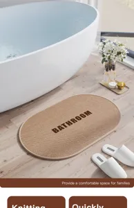 Detailed view of oval woven bathroom floor mat featuring textured design and anti-slip backing.