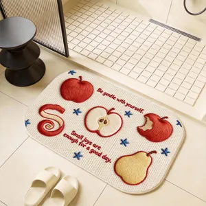 Detailed view of the cute cartoon fruit embroidered bathroom absorbent non-slip floor mat.