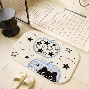 Detailed shot of cute cartoon black cat bath mat with blue apple pattern for bathroom floor.