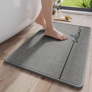 Grey bathroom floor mat with welcome text, non-slip absorbent shower rug for home.