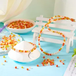 Colorful DIY glass seed bead necklace and bracelet set featuring a cute silver moon pendant.