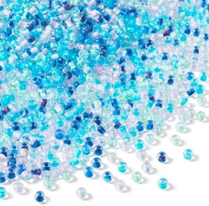Close-up detail shot of mixed blue glass seed beads, perfect for DIY jewelry crafting.