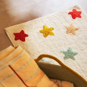 Cozy plush kids room rug with colorful tufted stars, soft anti-slip bedroom bedside mat.