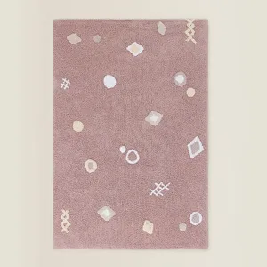 Detailed view of the soft mauve plush rug showing fine texture and cute designs.