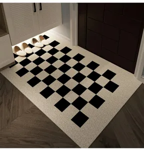 Detailed shot of modern minimalist entryway door mat featuring classic black and white checkerboard pattern.